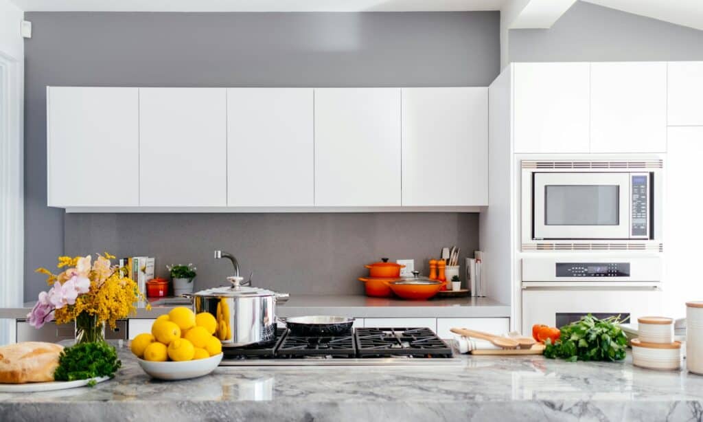 Modern white kitchen with marble island