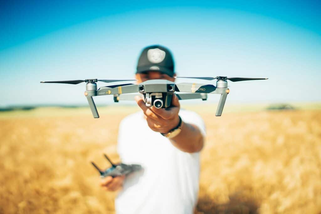 Drone pilot launching a drone