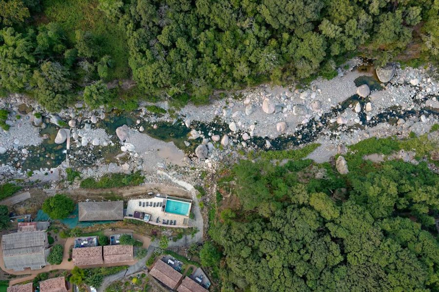 Aerial photo of a pool beside a river