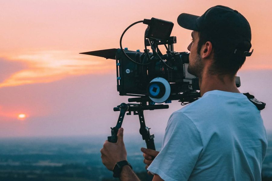 Videographer filming with a cinema camera